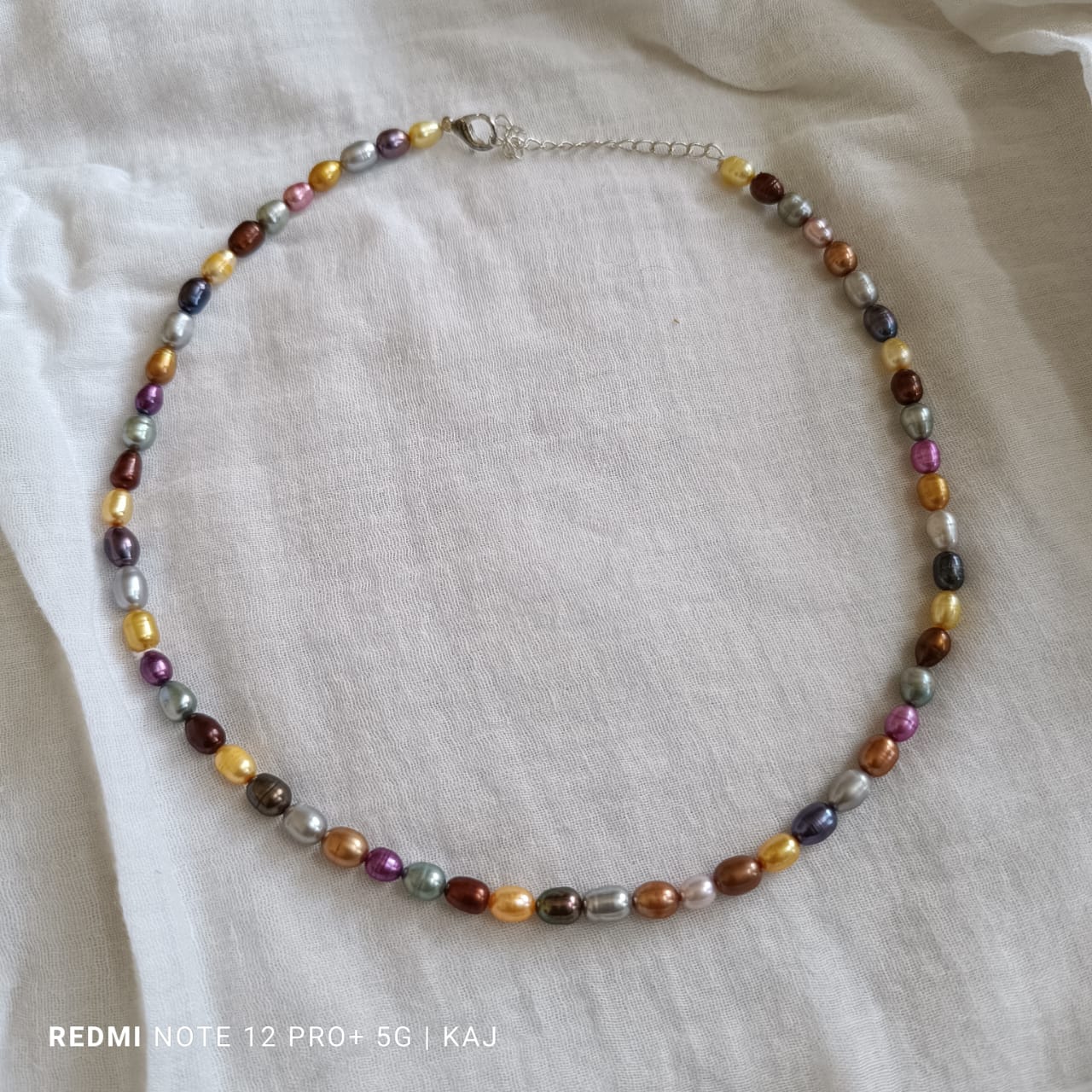 Real Pearl's multicolour neckline